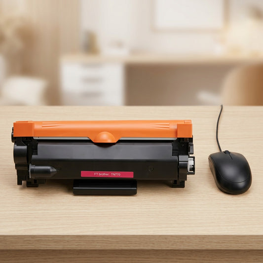 A compatible Brother TN770 toner cartridge shown in correct scale on a desk next to a standard computer mouse.