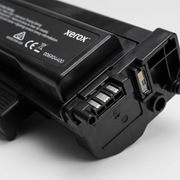 Extreme close-up of a Genuine Xerox Black High Capacity Toner Cartridge, highlighting a precise end connector and the matte black texture.
