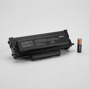Xerox 006R04401 toner cartridge next to a standard AA battery for scale.