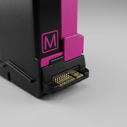 An extreme close-up view focusing on the contacts or texture of the genuine xerox 006R04358 magenta toner cartridge, with shallow depth of field.