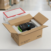 A pristine Xerox cyan toner cartridge sits securely inside custom-fit protective foam within a clean shipping box.