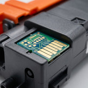 Extreme close-up of the Gold-plated contact chip on the Balloon Compatible TN229XLBK Toner.