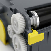Macro photo of Balloon Brand yellow toner gears and roller assembly.