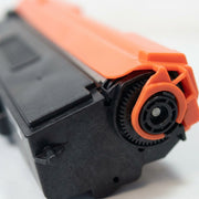 Macro view focusing on the precision gears and material joinery of the TN336 black toner.