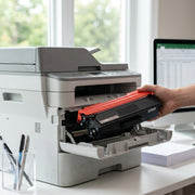 Lifestyle scene of the black and red compatible TN336BK toner cartridge installed in an open printer tray.