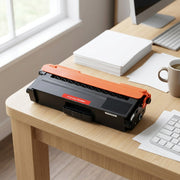 A photograph of the black CTTN339BK toner cartridge resting on a clean wooden office desk beside an open stack of paper.