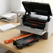 An angled product shot showing the compatible TN830XL toner cartridge installed in a home/office laser printer.