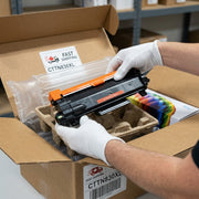 High-resolution photo showing a black TN830XL toner cartridge in protective airbags and box.