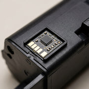 Extreme macro view of the W1340X toner cartridge showing the integrated high-yield chip and gold contacts.