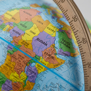 Macro inspect close-up of globe cartography showing sharp edge-to-edge printing of African nations.