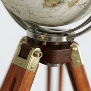 Macro detail: central gimbal hardware and upper leg bracket of the Eaton III tripod globe.