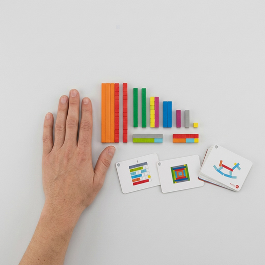 Scale reference image showing the fdmt Busy Play Number Rods next to a human hand for size context