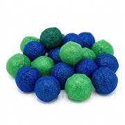 A high-resolution, centered photograph of the green and blue Manimo stress balls from the display box.