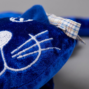 Close-up view showing the soft velvet texture and precise embroidery of the fdmt manimo weighted cat.