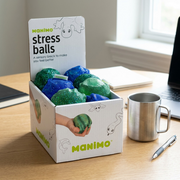 Scale reference of fdmt sensory stress balls on a desk beside an object, illustrating size.