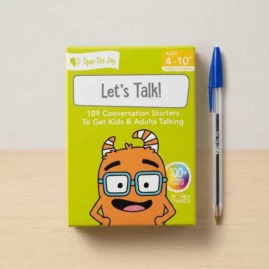 Let's Talk conversation cards box next to a ballpoint pen.