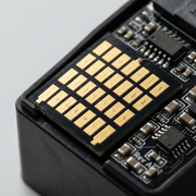 A close-up detail shot of the micro-texture precision contact pads on the Elevate Imaging toner cartridge.