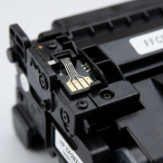 An extreme close-up photograph of the electronic contact points and toner level chip on the Randmar compatible HP CF287A toner cartridge.