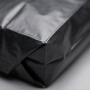 Macro close-up shot of the high-performance Inteplast plastic can liner, showing its fine, non-glossy, texture.