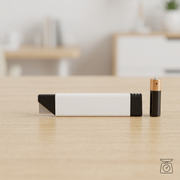 A scale reference image comparing the Olfa carton cutter from image_0.png with a standard AA battery.