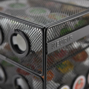 Extreme macro photo showing the fine texture of the black wire mesh and clear Keurig branding on the rack.