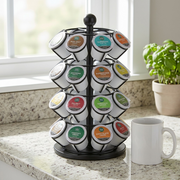 A photo of the Keurig K-Cup Carousel beside a common ceramic coffee mug for size comparison.
