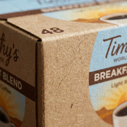 Macro detail of the fibrous texture on Timothy's 48ct Breakfast Blend coffee box.