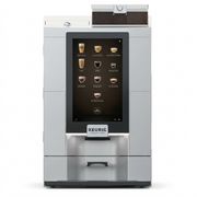 A high-resolution product shot of the stainless steel Keurig Eccellenza Momentum commercial coffee machine with its large touchscreen display.