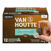 A single Van Houtte k-cup on a white background, held between a thumb and index finger for scale.