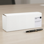 Product scale reference showing the toner box alongside a fountain pen on a desk for size perspective.