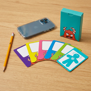 A photograph showing the Anger Management Cards deck and fanned cards placed next to a common pencil and smartphone for scale.