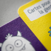 Extreme close-up of texture and color details on fdmt social skills game cards.