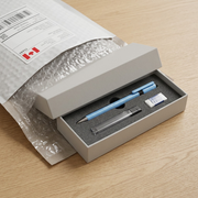 A premium unboxing visual showing the 0.5mm triplus micro mechanical pencil (SKU: 7742530A6) safely delivered.