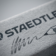 A detailed macro closeup of the STAEDTLER art eraser, highlighting its malleable, grey texture.