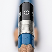 Macro shot of the STAEDTLER Mars Lumograph 6B pencil's specific rear lead grade and ferrule design.
