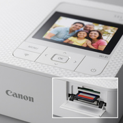 An extreme close-up view focusing on the Canon SELPHY CP1500 white printer's detailed textured surface, control buttons, and clear color screen.