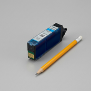 A scale-reference image showing the dark Canon CLI-281XL Cyan ink cartridge next to a standard yellow-bar-top pencil on a clean desk.