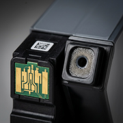 Extreme macro photograph showing the precise contact points and the texture of the Canon PGI-280XXL ink port.