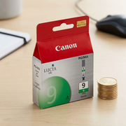 A realistic scale reference photograph of a Canon PGI-9 Green Ink Tank placed beside a standard AAA battery, shown in proportion.