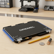 Dremel 3D40-FLX build plate with a pen and battery for scale.