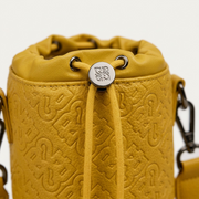 A detailed close-up of the embedded 'RR' logo on the yellow PU leather, metal hardware, and cordage.
