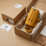 A premium unboxing display showing the Bugatti Champagne Bag protected within custom eco-friendly packaging.