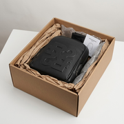 Premium delivery showing the Bugatti Rick Ross backpack cushioned in a sturdy shipping box.