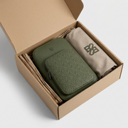 A photo of the Bugatti sling bag safely nestled with protective buffers inside a branded kraft shipping box, emphasizing a damage-free delivery.