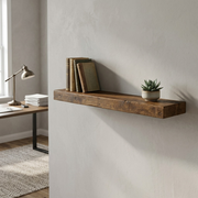 A realistic photo of the Entrepot La Grange inc 48-inch Medium Walnut floating shelf mounted in a home office above a desk, featuring books and a plant. (About 130 characters)