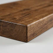 Macro photograph of the solid wood shelf, focusing on the refined grain texture and precise joinery.