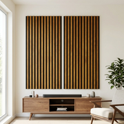 A living room wall showing an application of the vertical slatted whiskey-colored acoustic panels.