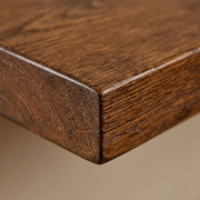 Macro close-up on the precise corner detail and authentic wood grain of the Whiskey Brown rustic solid wood shelf.