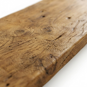 A macro photo captures the intricate, distressed honey wood grain and texture of the La Grange shelf.