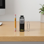 A Canon PGI-35 Black Ink Tank is shown next to a pencil and paperclip for a clear scale reference.